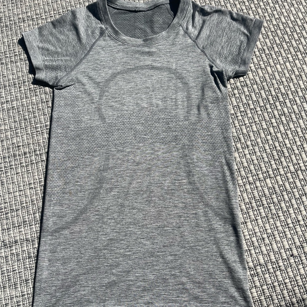 lightly worn gray lulu top